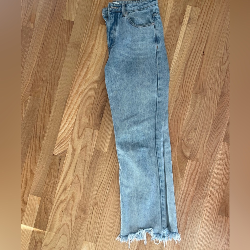 Light Blue Straight Leg Jeans with Distressed Hem